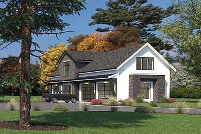 A custom home design, this two-story house features dark brick and white siding nestled amidst trees and landscaping. With a well-planned driveway and a car in front, it's the epitome of craftsmanship by skilled building designers.