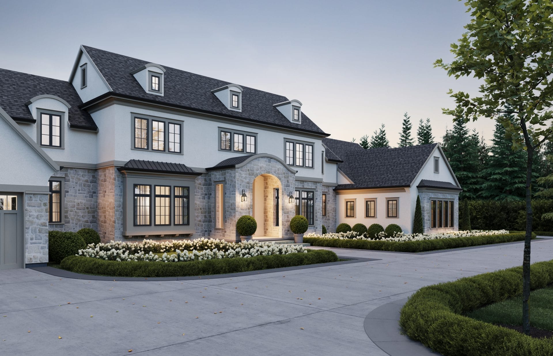 Large two-story custom farmhouse with stone and stucco exterior, arched entryway, manicured landscaping, and a circular driveway lined with shrubs and flowers.